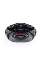 Black leather clutch with red lips interior on a white background